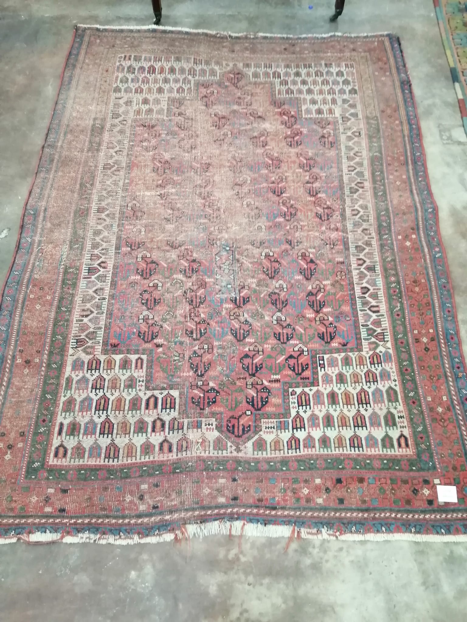 An antique North West Persian red ground rug, 170 x 118cm